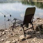 Krzesło wędkarskie z podnóżkiem Nils Camp NC2703 - zielono-czarne Krzesło wędkarskie z podnóżkiem Nils Camp NC2703 - zielono-czarne